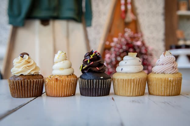 five different artfully created cupcakes