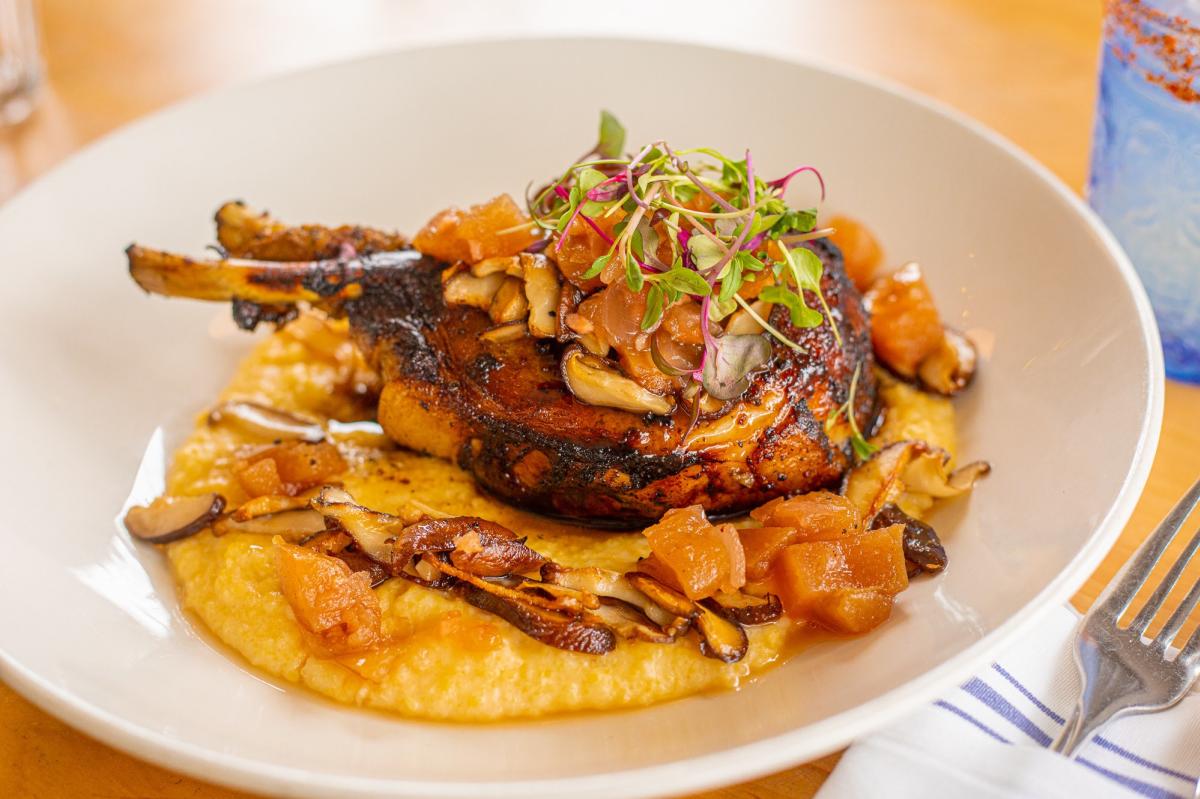 double bone in Berkshire pork chop with our cheesy poblano grits