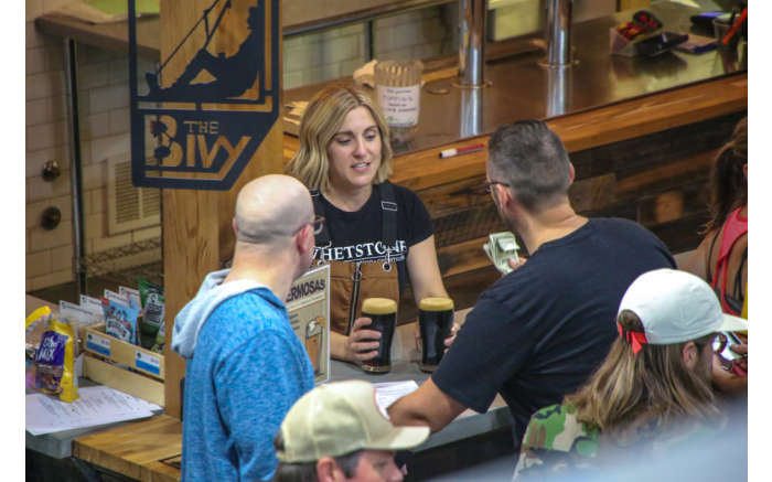 Members enjoying a cold beer at The Bivy, our on-site cafe & bar